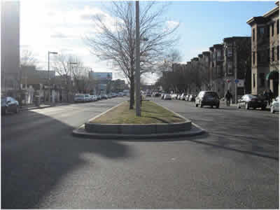 Figure 2 is photograph of a typical section of Brighton Avenue showing that it is a four-lane divided roadway with a raised median and adjacent on-street parking.