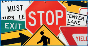Collage of traffic control and warning signs.