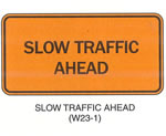 Temporary Traffic Control Signs "SLOW TRAFFIC AHEAD (W23-10" is shown as a horizontal rectangular sign. It shows the words "SLOW TRAFFIC AHEAD" on two lines.