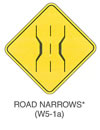 Warning Sign "ROAD NARROWS (W5-1a)" is shown as a diamond-shape sign. It shows two vertical lines that are narrow at the center of the road, with short vertical dotted line between the two lines. This sign was anticipated for inclusion in the 2003 edition of the MUTCD at the time of this printing.