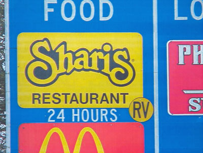 Close-up of RV-Friendly symbol in use on a food-lodging sign.