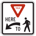 This graphic shows the sign images from Figure 2B-2 of the 2009 MUTCD for the Yield Here To Pedestrians (R1-5) sign and the Stop Here For Pedestrians (R1-5b) sign.