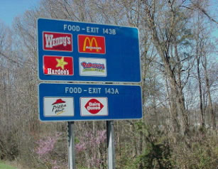 Image shows Full service food logos sharing motherboard with camping logo of Exit 143A and 143B (I-95) 