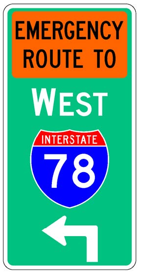A vertical rectangular single sign with a green background color.  It includes a white directional arrow above which is a full color Interstate route shield above which is a white cardinal direction word legend above which is an orange rectangular background panel with the words "Emergency Route To" in black letters.