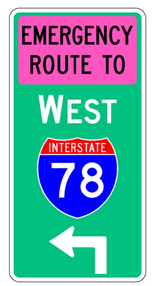A vertical rectangular single sign with a green background color.  It includes a white directional arrow above which is a full color Interstate route shield above which is a white cardinal direction word legend above which is a fluorescent pink rectangular background panel with the words "Emergency Route To" in black letters.