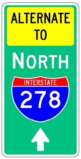 A vertical rectangular single sign with a green background color.  It includes a white directional arrow above which is a full color Interstate route shield above which is a white cardinal direction word legend above which is a yellow rectangular background panel with the words "Alternate To" in black letters.