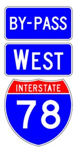 A sign assembly comprised of a full color Interstate route shield sign above which is a white-on-blue cardinal direction auxiliary sign above which is a white-on-blue "By-Pass" auxiliary sign.