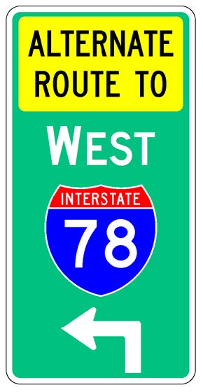 A vertical rectangular single sign with a green background color.  It includes a white directional arrow above which is a full color Interstate route shield above which is a white cardinal direction word legend above which is a yellow rectangular background panel with the words "Alternate Route To" in black letters.