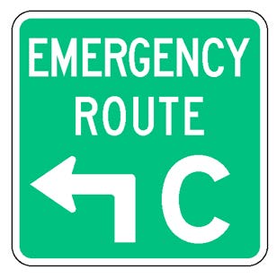 A square single sign with a green background color.  The legend reads "Emergency Route" in white letters at the top of the sign below which is a white directional arrow that has a white upper-case "C" to its right to identify the route.