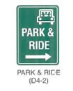 Guide Sign "PARK & RIDE (D4-2)" is shown as a vertical rectangular green sign with white borders and legends, with a white outline symbol of a vehicle carrying five persons in the top right corner of the panel. Under this outline symbol the words "PARK &" are shown on the top line and the word "RIDE" is shown on underneath and at the bottom is a horizontal arrow pointing to the right.