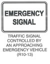 Regulatory Sign "TRAFFIC SIGNAL CONTROLLED BY AN APPROACHING EMERGENCY VEHICLE (R10-13)" is shown as a horizontal rectangular white sign with a black border and the words "EMERGENCY SIGNAL" in black on two lines.