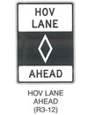 Regulatory Sign "HOV LANE AHEAD (R3-12)" is shown as a vertical rectangular white sign with a black border and legend. The words "HOV LANE" are shown on two lines on the top third of the sign above a black panel with a white diamond outline symbol centered horizontally, which is above the word "AHEAD" on the bottom line of the sign.