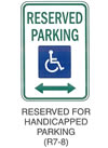 Regulatory Sign "RESERVED FOR HANDICAPPED PARKING (R7-8)" is shown as a vertical rectangular white sign with a green border and the words "RESERVED PARKING" in green on two lines above a blue handicapped symbol. A two-direction horizontal green arrow is shown below the symbol.