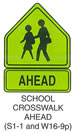 Pedestrian and Bicycle Sign "SCHOOL CROSSWALK AHEAD (S1-1)" is shown as an upward-pointing pentagon-shaped green sign with a black border and black symbols of two left-facing children walking. W16-9p is shown with the word "AHEAD."