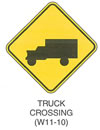 Warning Sign "TRUCK CROSSING (W11-10)" is shown as a diamond-shaped sign with a symbol of a left-facing box truck.