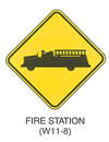 Warning Sign "FIRE STATION (W11-8)" is shown as a diamond-shaped sign with a symbol of a left-facing fire engine.