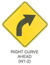 Warning Sign "RIGHT CURVE AHEAD (W1-2)" is shown as a diamond-shaped sign with an arrow curving up and to the right.